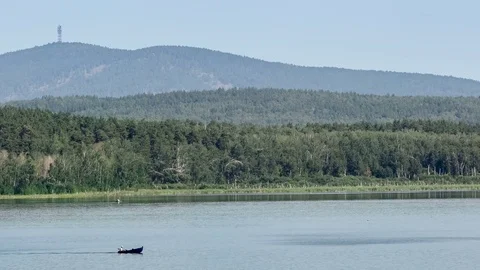 Motor boat rides on a mountain river. Place of meteorite fall. Chebarkul lake 動画素材 74074655