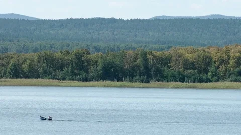 Motor boat rides on a mountain river. Place of meteorite fall. Chebarkul lake Stock Footage 74076416