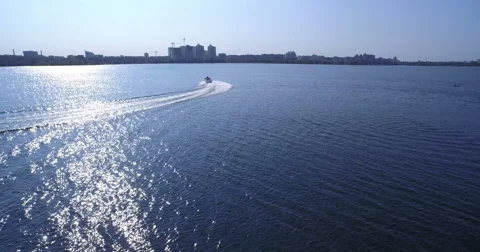 Motor boat sailing on the surface of the river Stock Footage 61304515