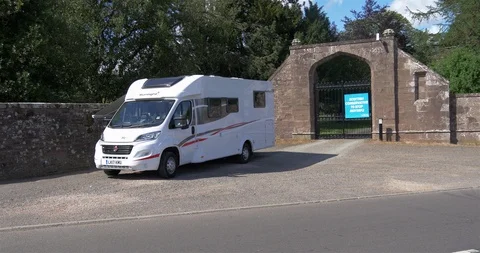 Motor home in front of stone wall Stock Footage 88694599