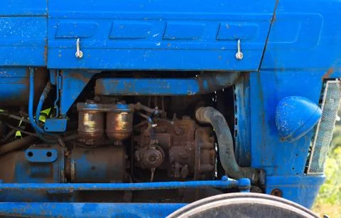 Motor of the old blue tractor Stock Photos