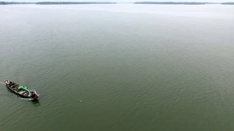 Motor pirogue going toward the Douala bridge Stock Footage 80963343
