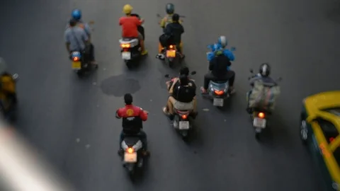 Motor Scooter Riders Group move to traffic jam in Huge asian city. Urban concept Stock Footage 103333395
