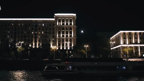 A motor ship is moving along the river at night in the city Stock Footage 318964839