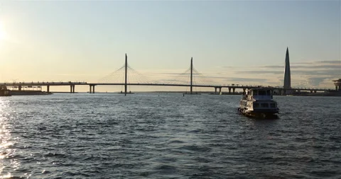 The motor ship passes along the river against the background of the suspension Stock Footage 101759743