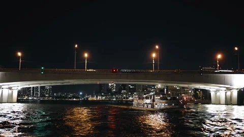 A motor ship is sailing along the night river in the city Stock Footage 318964861