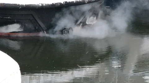 Motor ship in winter, running engine, around steam and smoke Video stock 121618348