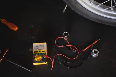 Motor testing multimeter and tools on floor Stock Photos