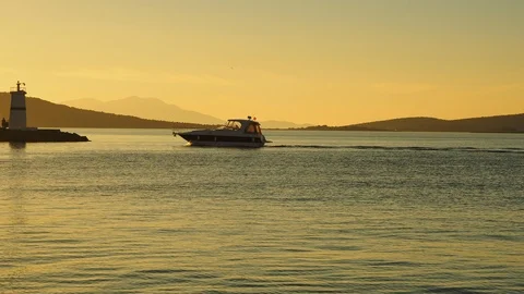 Motor yacht,sunset Lighthouse Stock Footage 87099922