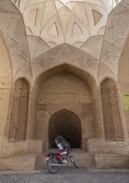 Motorbike in front of the entrance of a water reservoir, Yazd Province, Meybod, Stock Photos