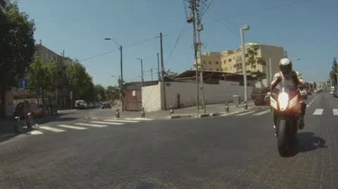 Motorbike motorcycle Tel Aviv city rider riding biker driver drive driving Stock Footage