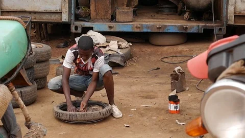 Motorbike tyre fixing Stock Footage