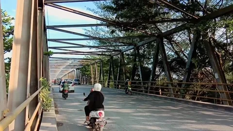 Motorbikes and buses on the bridge road Stock Footage 179843511