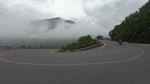 Motorbikes on a cloudy mountain Hai Van pass in Danang, Vietnam 스톡 동영상 219677487