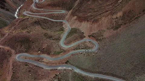 Motorbikes Riding Tight Switchbacks on Mountain Road Drone View Stock Footage 311554207