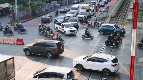 Motorbikes Weaving Through Congested Bangkok Rail Crossing Traffic Stock Footage 323433260