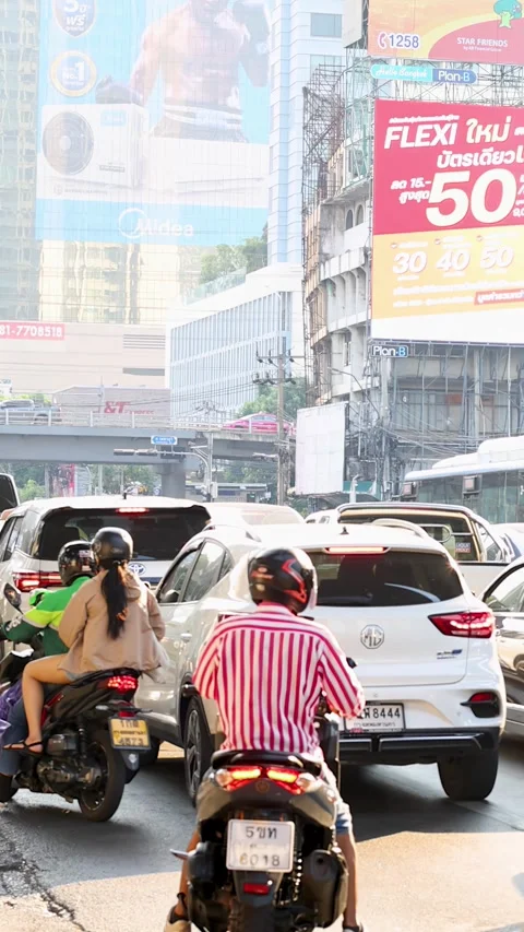 Motorbikes Weaving Through Congested Bangkok City Traffic Stock Footage 324844688