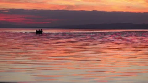 Motorboat approaching at sunset Stock Footage 45099274