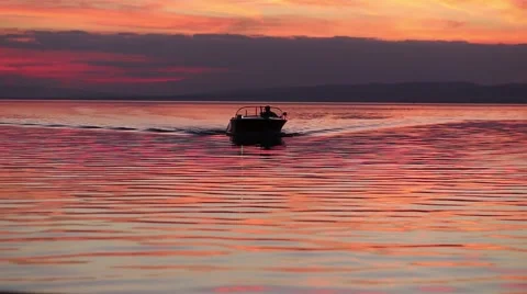 Motorboat approaching at sunset Stock Footage 45099290