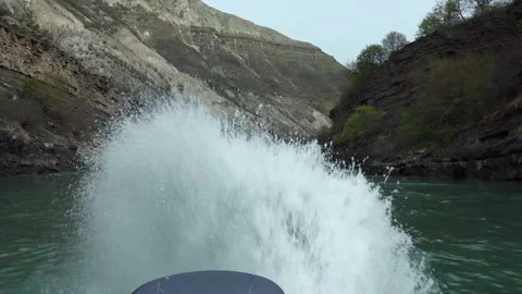 Motorboat engine starts making splashes in river of Sulak Canyon, Dagestan Video stock 194680509