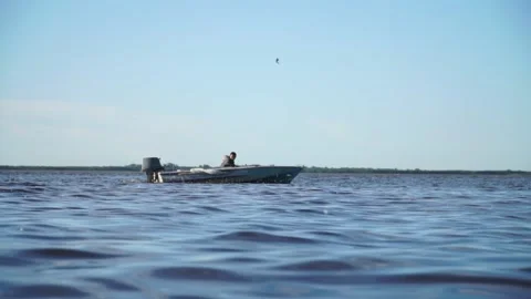 Motorboat floats on the river Stock Footage 140382628