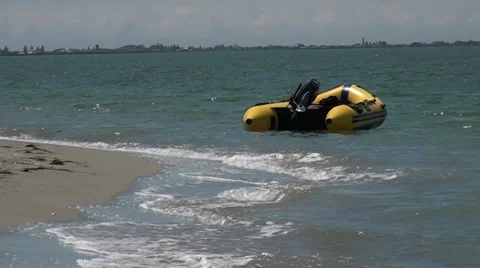 A motorboat floats at-sea on waves Stockbeeldmateriaal 36295053
