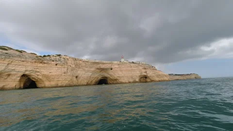 Motorboat Journey Along Dramatic Limestone Cave Coastline of Portuguese Algar Video stock 309531535