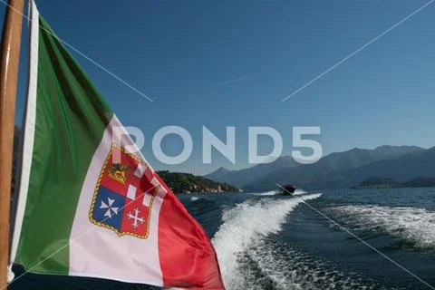 Motorboat on Lake Como with Italian flag Stock Photos