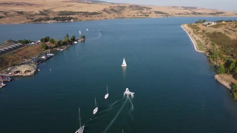 Motorboat leaves the harbor Stock Footage 168574530