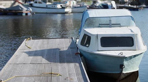 Motorboat moored at the pier Stock Footage 43862136