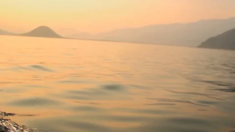 Motorboat moves in the direction of the sun. Video stock 102779602