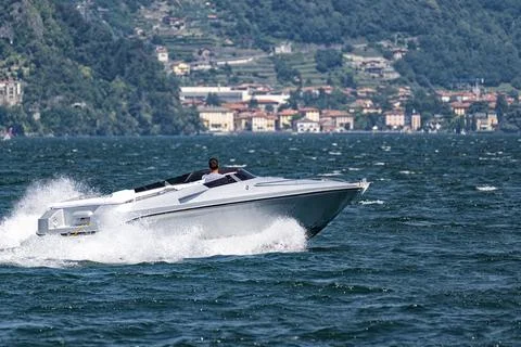 Motorboat navigating on Lake Como Stock Photos