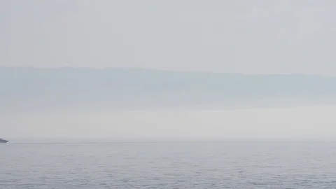 A motorboat passes on the horizon Video stock 82972089