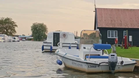 Motorboat on the river bobbing up and down with the waves Video stock 252517203