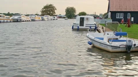 Motorboat on the river bobbing up and down with the waves Video stock 252517345