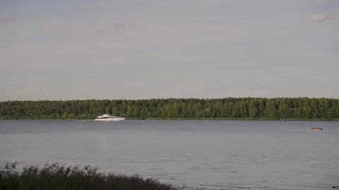 A motorboat sails down the river, slow motion video Stock Footage 329248849