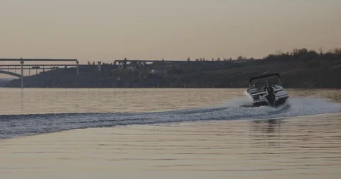 Motorboat speeding on a river Stock Footage 120295716