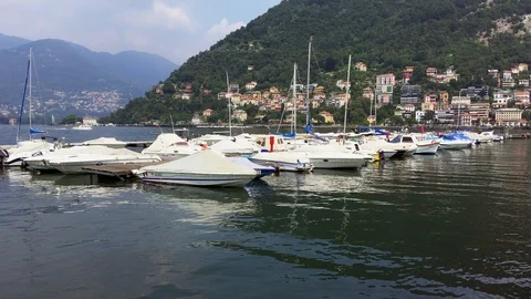 Motorboats float on the waters of Como lake Stock Footage 118649214