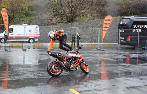 Motorcycle acrobat performing Stock Photos