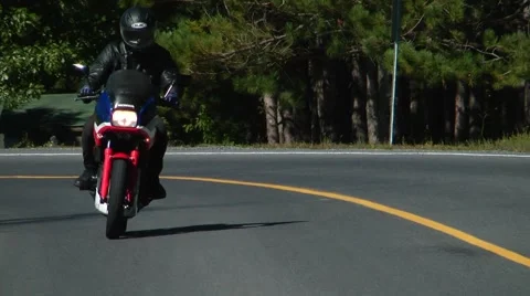 Motorcycle action taking a corner Stock Footage 51702602