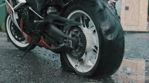 Motorcycle after burnout with explosion wheel. Big damage Stock Footage 131369056