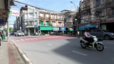 Motorcycle and Traffic Moving Through Busy Bangkok Street Intersection Video stock 339513542