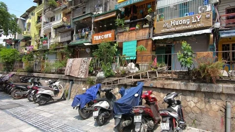 Motorcycle are parked on the side of a building in the old quarter in Hanoi, Stock-Footage 157152572