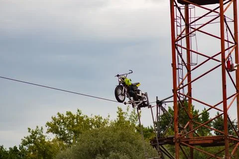 Motorcycle Balancing On A High Wire 스톡 사진