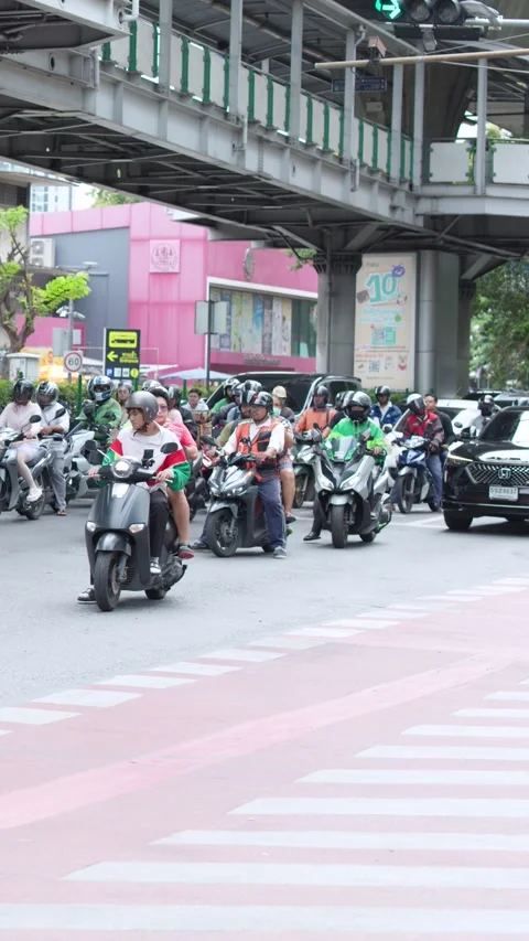 Motorcycle Commuters Driving Through Busy Bangkok City Intersection Stock Footage 340135098