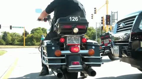 Motorcycle Cop Drives Away Video stock 12599641