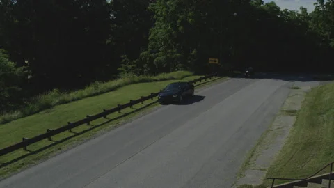 Motorcycle Cop Pulls over a Sports Car for a Traffic Violation Video stock 222006124