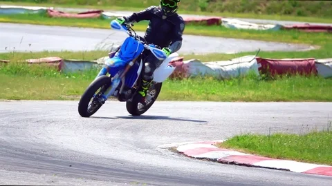 Motorcycle cornering on racing circuit Stockbeeldmateriaal 111342377