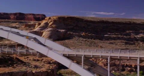 Motorcycle crossing bridge over the Colorado River, Glenn Canyon Stock Footage 59597023