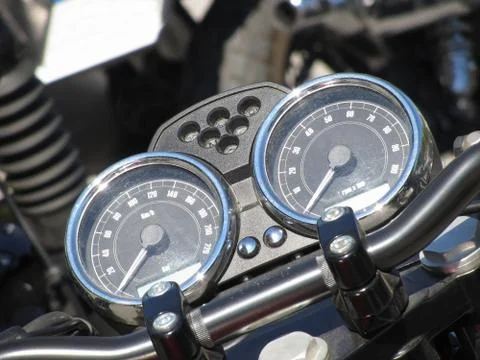 Motorcycle dash display instruments with speedometer and tachometer Stock Photos